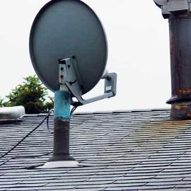 Here the installer took the easy way out, and installed the T.V. satellite dish right INTO the plumbing vent pipe. These pipes must remain clear and open to allow the plumbing inside the home to drain properly.