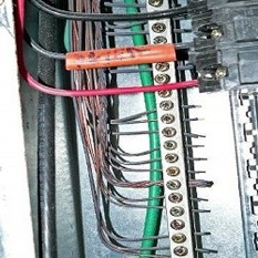 Here we check the wire in a Load Center. If they're turning black, chances are there is Chinese drywall in the home.